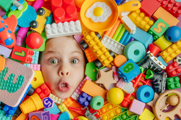 istock Child's head lying on the toys background 1354820116
