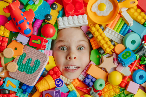 istock Child's head lying on the toys background 1354820191