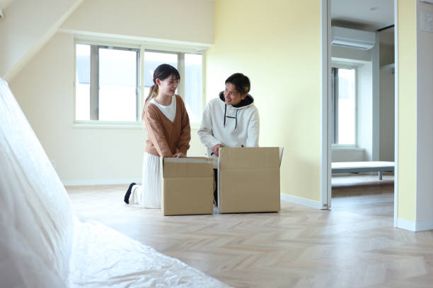 istock Happy multi-ethnic couple moving new house 1354823750