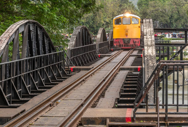 Thai train on the landmark bridge at Kanchanaburi