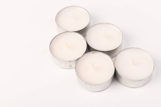 istock Many wax candles together on the white background. Space for text 1354824233
