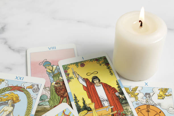 istock Assortment of Tarot inspired cards on a marble 1354825150