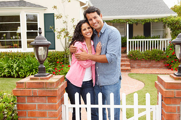 istock Hispanic couple outside home 135482523