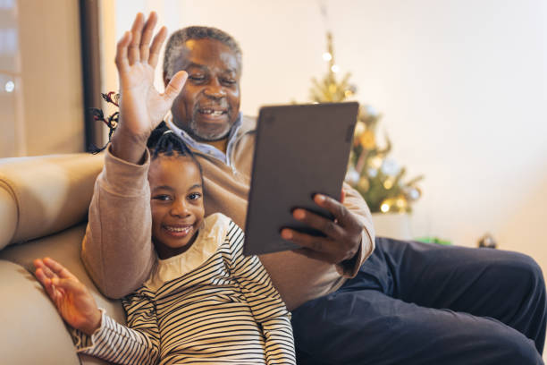 istock Girl having video call with grandfather 1354825334