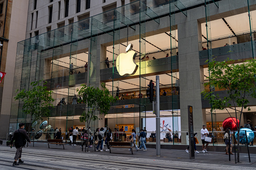 Queue of people in front of Apple retail store in Sydney central business district, Australia on 20 November 2021. Line of people wait outside the shop.