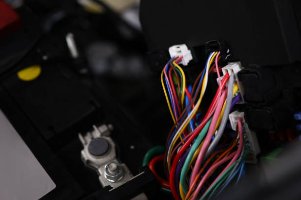 istock Large wide cable with multicolored wires and connectors in car 1354827097