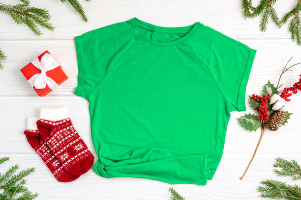 istock T-shirt socks and gift box with Christmas decor on white 1354831654