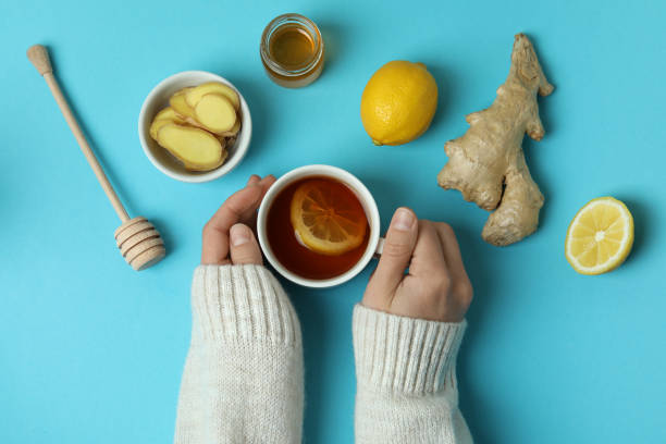 istock Female hands and alternative medicines on blue background, top view 1354833161