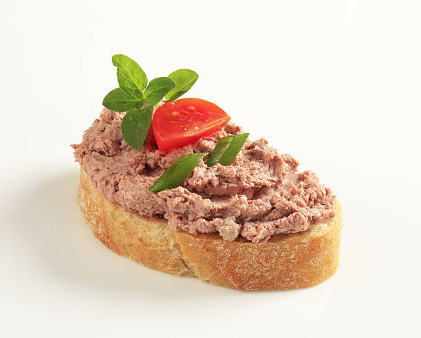 istock Slice of bread with pate and tomato on its top 135483357