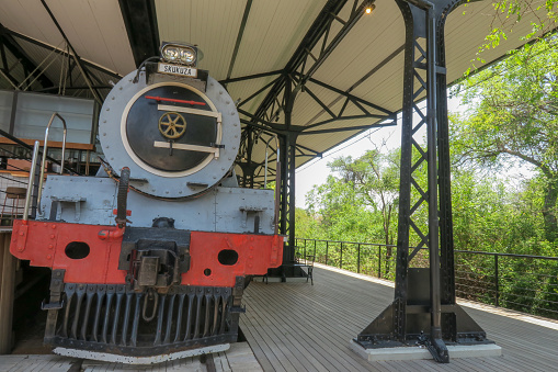 Front view of the vintage steam locomotive on the platform at Skukuza Rest Camp in Kruger National Park, South Africa.