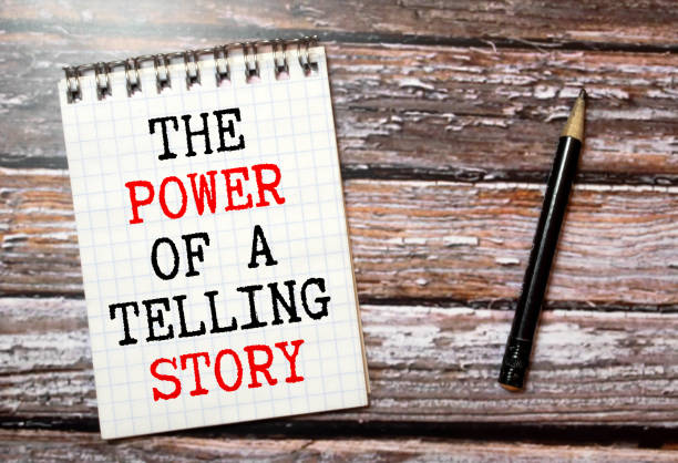 istock text THE POWER OF A TELLING STORY on white paper 1354837630