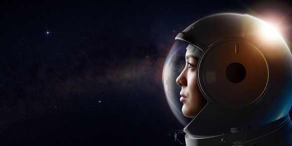 Head shot of attractive female astronaut wearing a helmet in outer space looking at planet earth. 3D rendering. Concept of space travel and exploration.