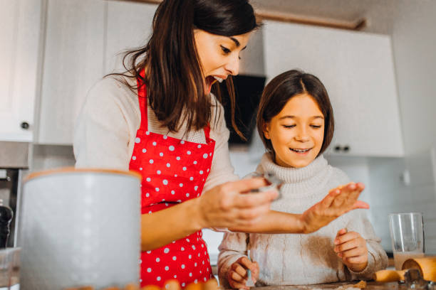 istock Mom with daughter on kitchen 1354838519