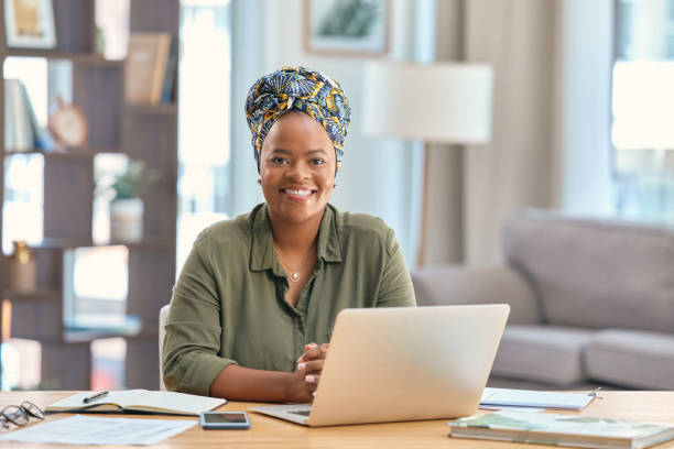 istock Shot of a young woman using her laptop at work 1354839538