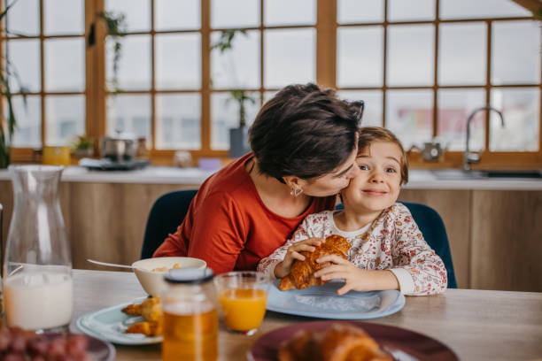 istock Mom and daughter having breakfast 1354839561
