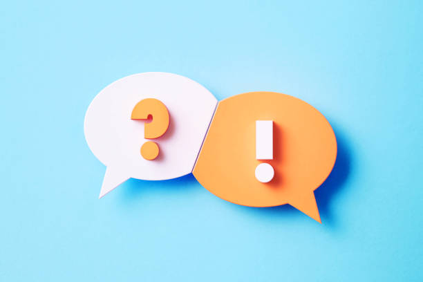 Q And A And Warning Concept - White and Pink Speech Bubble Pair With Question Mark And Exclamation Point Sitting Over Blue Background