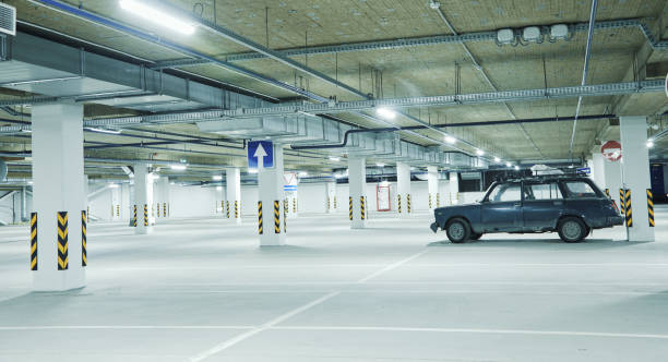 istock Horizontal image of clean white underground parking lot 1354840315