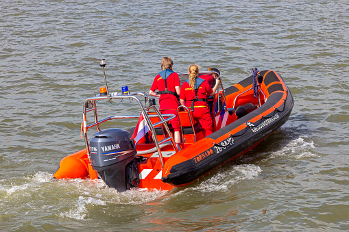 Search And Rescue speed boat and crew on the Meuse river  in Rotterdam. The Netherlands - September 8, 2012