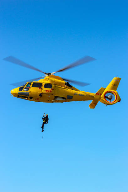 helicopter flying over the ocean
