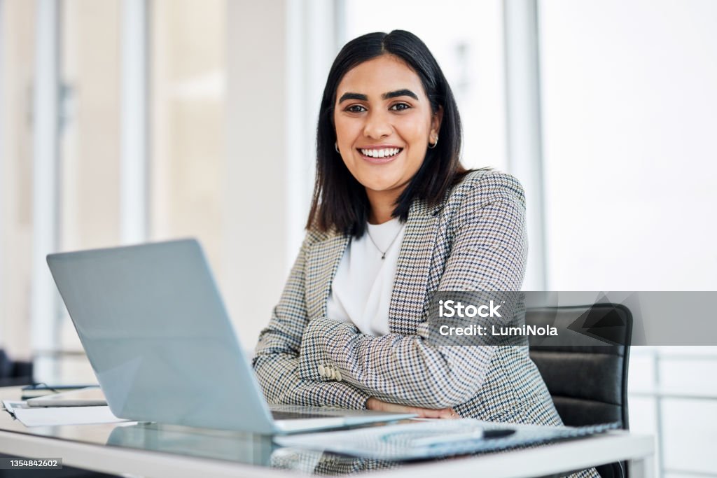 Portrait of a young businesswoman working on a laptop in an office Apply the best of yourself and you will succeed Women Stock Photo
