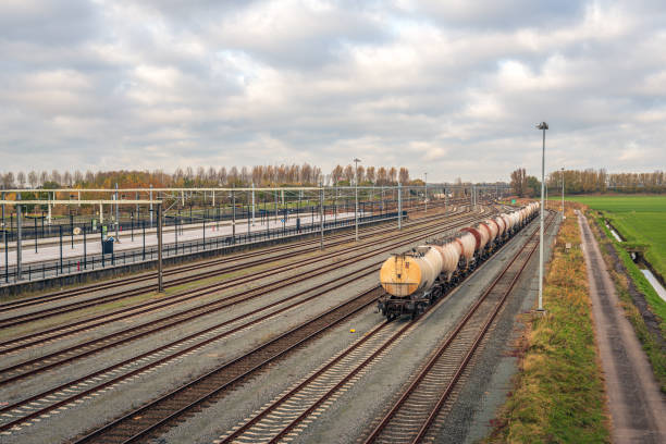 Freight train with tank wagons at the Dutch train station Lage Zwaluwe in the province of North Brabant. The photo was taken on a cloudy day in the autumn season.