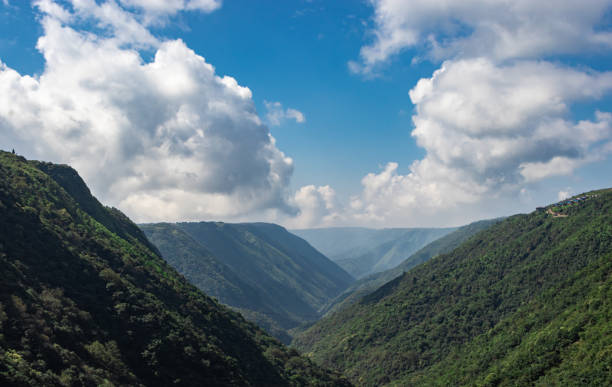 istock mountain valley with bright blue sky at morning from flat angle 1354843755