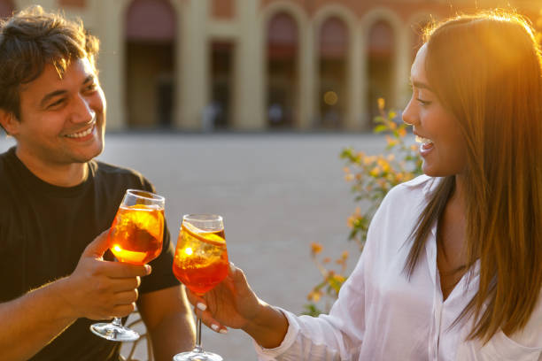 istock Cheerful couple  making a  toast 1354845005