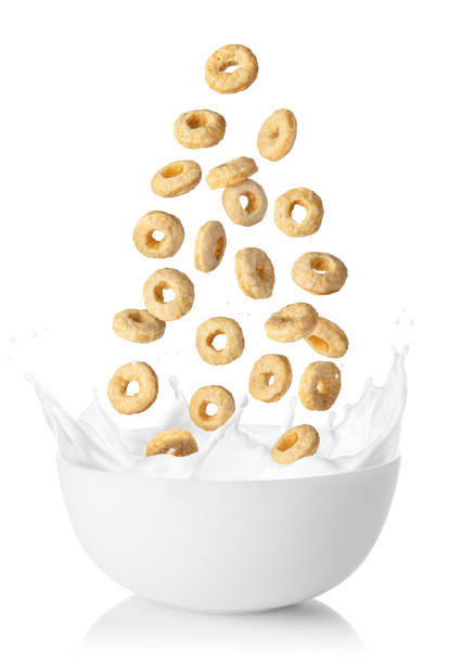 istock corn rings in air falling into bowl with splashing milk 1354845006