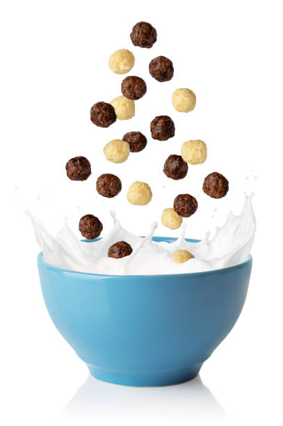 istock vanilla and chocolate corn balls falling in blue bowl 1354845012