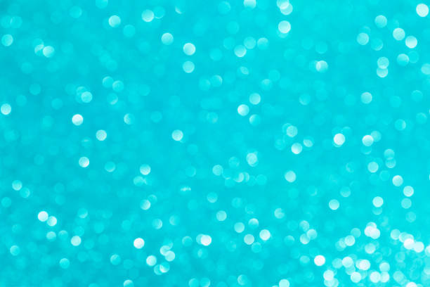 istock Abstract glitter blurred shiny blue aqua background. Bright sparkling bokeh wallpaper style. Festive Christmas holiday futuristic texture. 1354848509