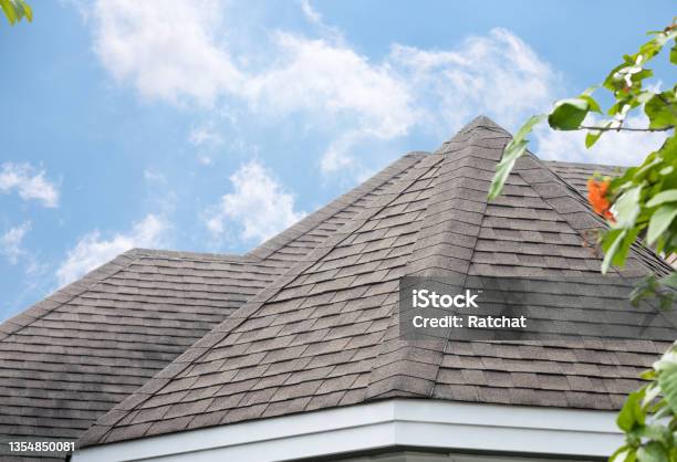 Edge Of Roof Shingles On Top Of The House Dark Asphalt Tiles On The Roof Background Stock Photo - Download Image Now