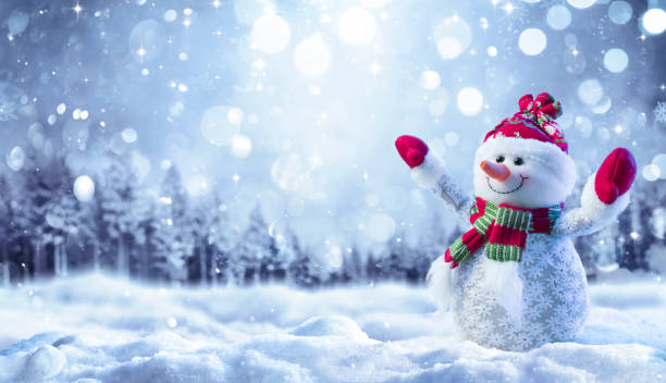 istock Snowman On Snow In Forest With Snowfall In Defocused Landscape 1354851149