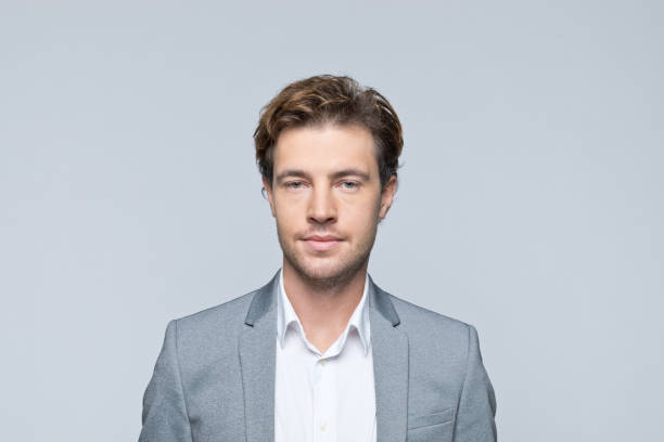 istock Headshot of friendly young businessman 1354852572