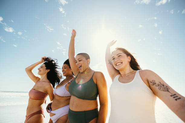 istock Young women celebrating spring break together 1354853420