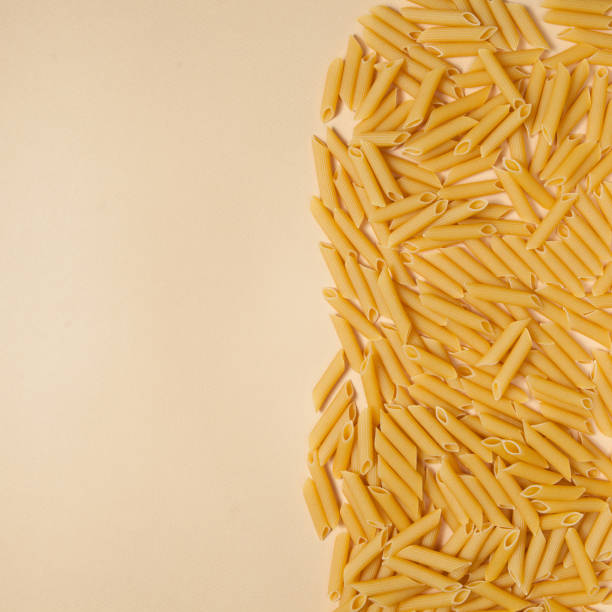 istock Penne pasta background. Pasta Penne texture background. 1354853989