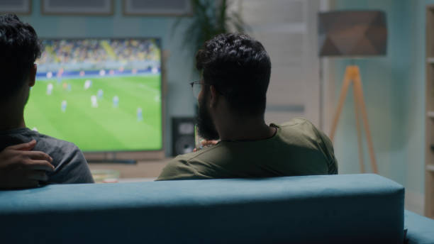 istock Indian man discussing match with friends 1354854406