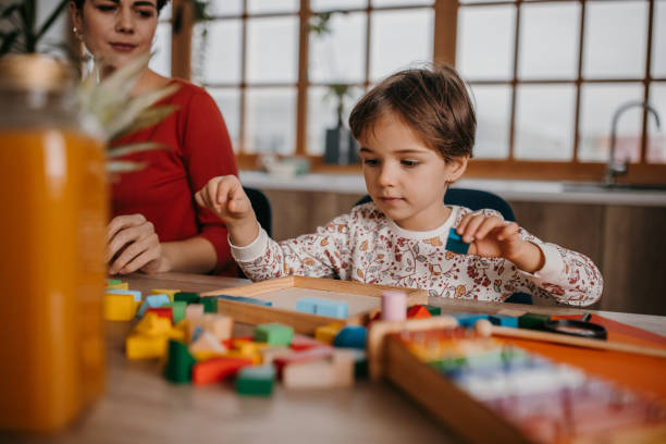 istock Mom and daughter playing time 1354854428