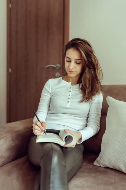 istock Young woman freelancer working from home 1354854595