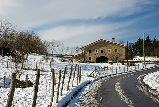 Basque farmhouse in winter Winter image of basque farmhouse in Durango (Vizcaya, Spain). alambrada stock pictures, royalty-free photos & images