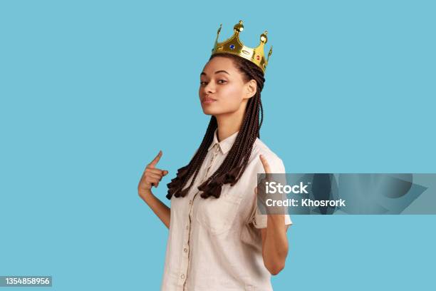 Arrogant Woman With Dreadlocks Standing In Gold Crown Pointing At Herself With Pride Stock Photo - Download Image Now
