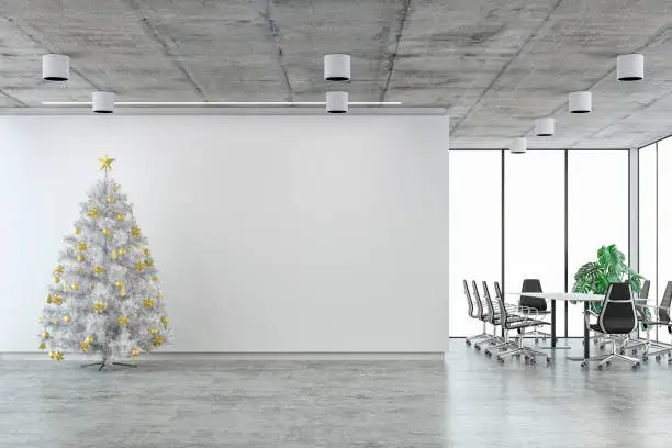 Photo of Empty office interior with conference table and white Christmas tree