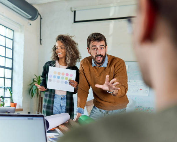 istock Creative people talking about plans on a meeting in the office. 1354864284