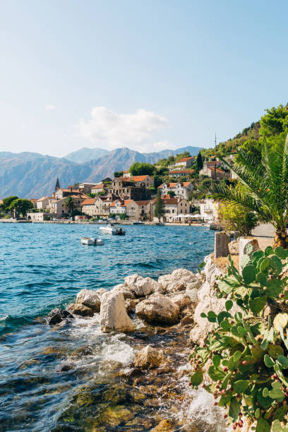 Perast rocky coastline with old houses. Montenegro Perast rocky coastline with old houses. Montenegro. High quality photo montenegro stock pictures, royalty-free photos & images