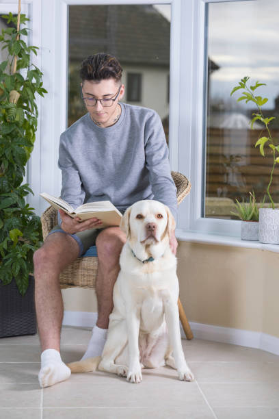 istock Young man and his dog 1354864739