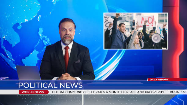 istock Live News Studio with Male Anchor Reporting on the Protesters March, Human Rights, Climate Change and any other Imporant Issues. Presenter, Anchor Talking. Mock-up Television Channel Newsroom Set 1354866096