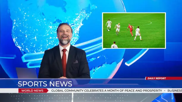 Photo of Live News Studio with Male Anchor Reporting Sports News on Soccer Game Score, Story Show Highlight of Two Teams Playing Football before Scoring Beautiful Goal. Mock-up TV Channel Newsroom