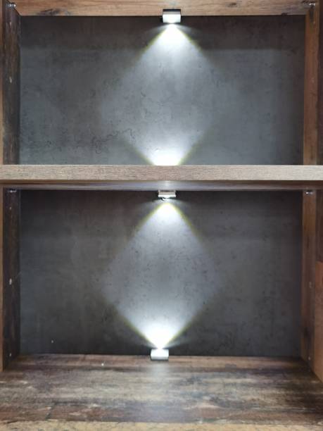 istock Shelf with lighting from above and below in gray colors 1354866456
