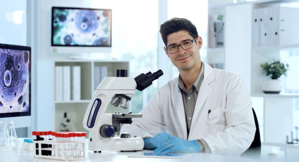 istock Shot of a young male scientist working in a lab 1354871105