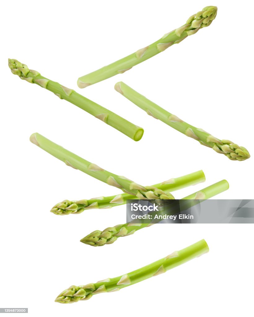 Falling asparagus isolated on white background, clipping path, full depth of field Asparagus Stock Photo