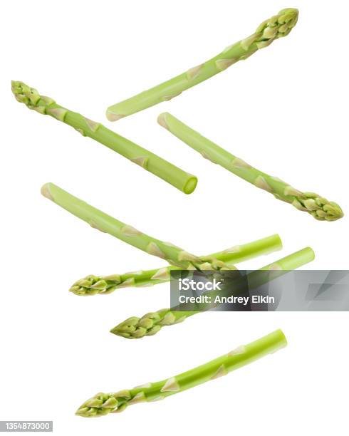 Falling Asparagus Isolated On White Background Clipping Path Full Depth Of Field Stock Photo - Download Image Now